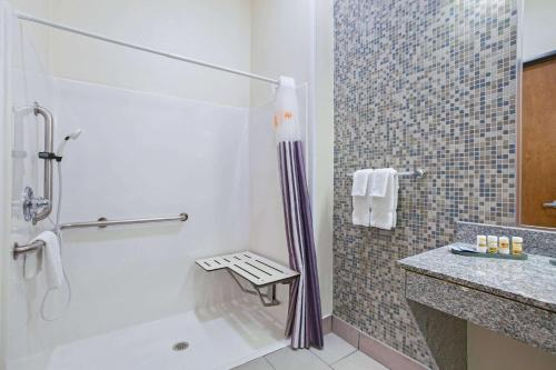 a bathroom with a shower and a sink at La Quinta by Wyndham Austin NW/Lakeline Mall in Cedar Park
