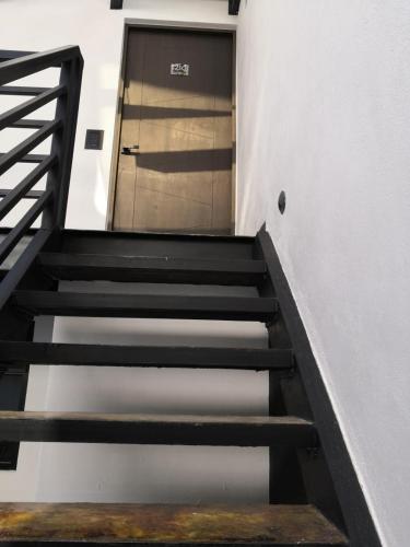 a staircase leading to a door in a building at Tepeyac 402 in León