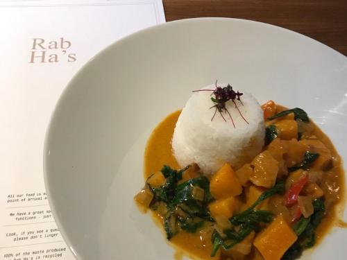 a plate of food with rice and vegetables on a table at Rab Ha's in Glasgow