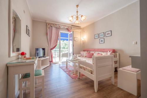 a small room with a bed and a desk at Marinero Apartments in Budva