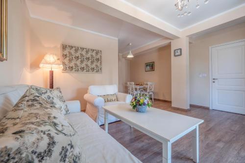 a living room with a couch and a table at Marinero Apartments in Budva