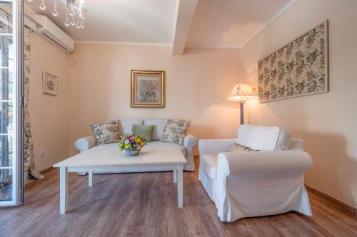 a living room with a couch and a table at Marinero Apartments in Budva
