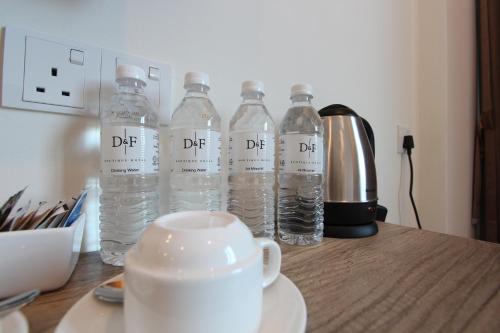 a group of water bottles sitting on a table at D&F BOUTIQUE HOTEL SEREMBAN 2 in Seremban