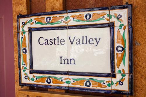 a sign on a wall that reads castle valley inn at Castle Valley Inn in Moab
