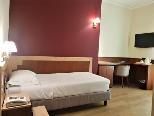 Postel nebo postele na pokoji v ubytování Astra Hotel