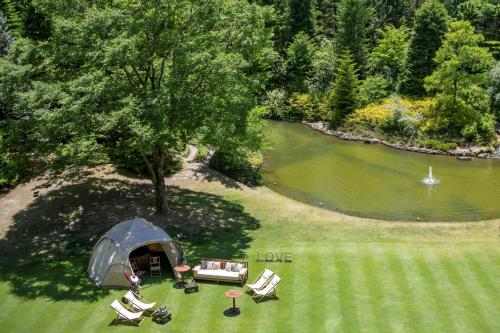 an overhead view of a tent and chairs and a lake at Sendai Royal Park Hotel in Sendai