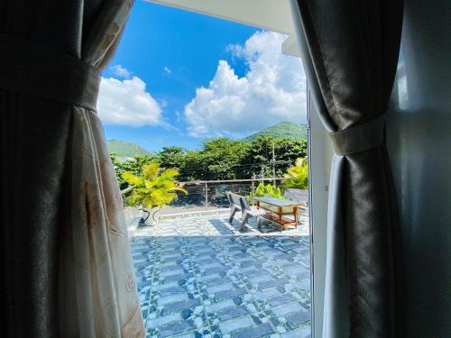 a window with a view of a patio at Thuy Thanh Hotel in Con Dao