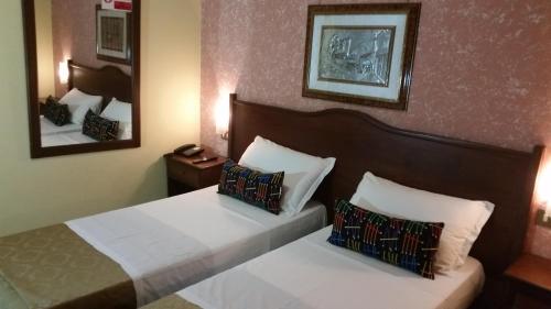 Postel nebo postele na pokoji v ubytování Hotel Chopin