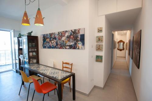 a dining room with a table and chairs at B&B ICHOME NAPOLI - Maison d'Artiste in Naples