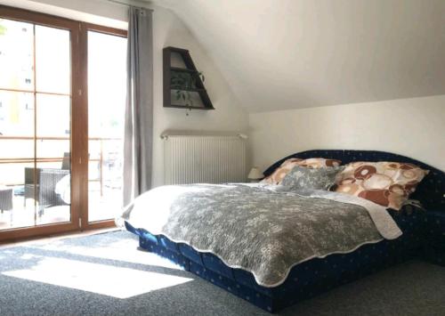 A bed or beds in a room at Apartmán v centre mesta