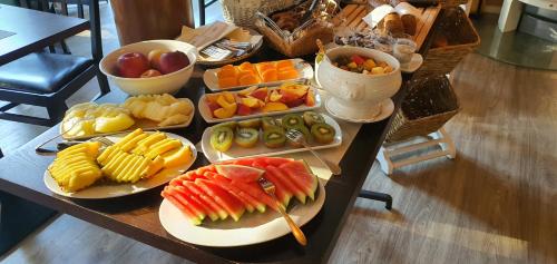 a table with different types of fruits and vegetables at Hotel Garni Auszeit in Boltenhagen