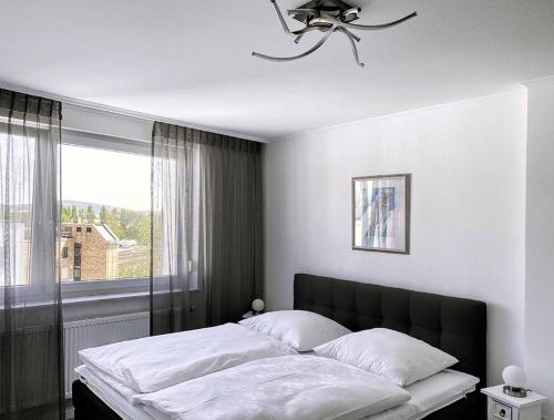 Una cama o camas en una habitación de Ferienwohnung Nußmann