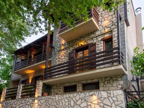 a building with balconies on the side of it at 4 Epohes in Elati Trikalon