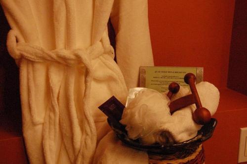 a statue of a woman in a basket next to a curtain at A Vacation Paradise at Quail Ridge B&B in Kelowna