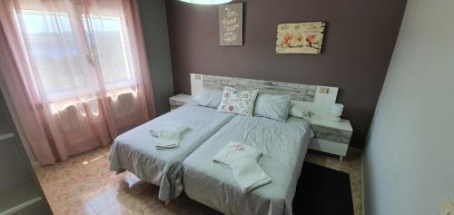 Кровать или кровати в номере Apartamentos Portolux