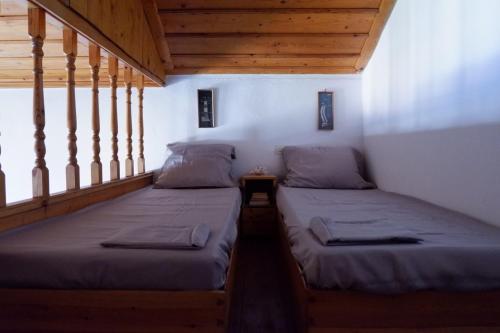 Postel nebo postele na pokoji v ubytování Asiminas House