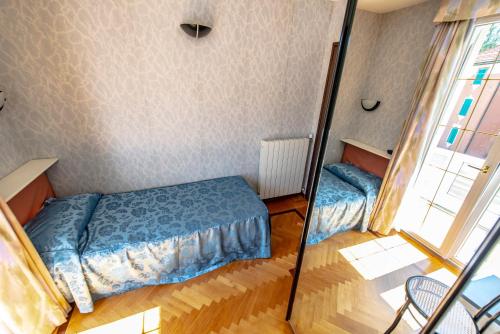 Tempat tidur dalam kamar di Hotel Pian Nava