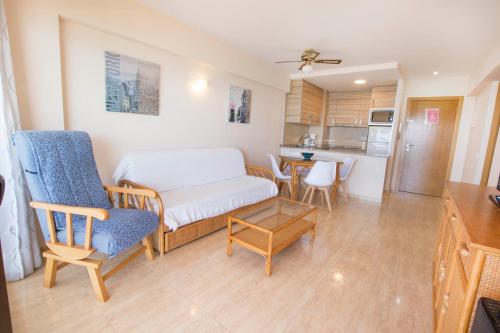 a living room with a couch and a table at Edificio Calpemar in Calpe