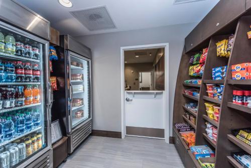 a grocery store aisle with drinks and food at Staybridge Suites Charleston - Mount Pleasant by IHG in Charleston