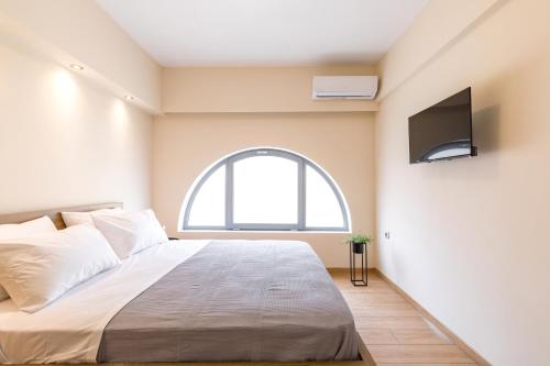 Posteľ alebo postele v izbe v ubytovaní Urban Lofts