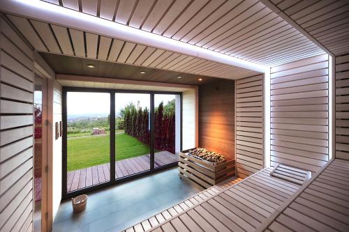 an inside view of a sauna with a large window at Schlosshotel Kassel in Kassel