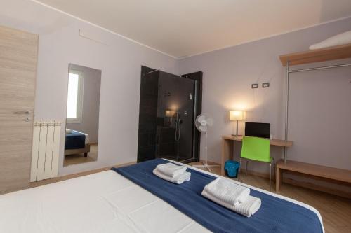 Ένα ή περισσότερα κρεβάτια σε δωμάτιο στο Hotel Genziana