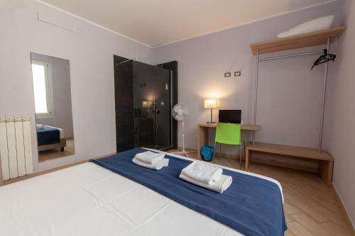 Ένα ή περισσότερα κρεβάτια σε δωμάτιο στο Hotel Genziana