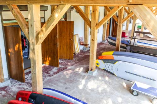 a room with several surfboards sitting inside of a building at Krokodyl Sport&Spa in Mielno