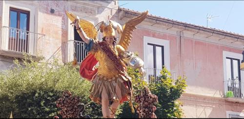 a statue of a woman with wings on a building at Hotel Vallisdea in Sala Consilina
