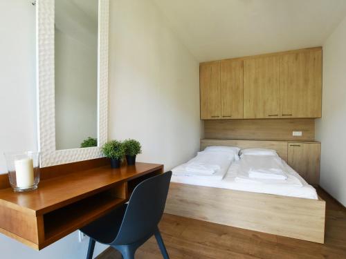En eller flere senge i et værelse på VacationClub - Karkonoska 13 Apartament 61