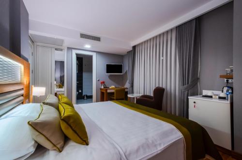Katil atau katil-katil dalam bilik di Evimiz Hotel