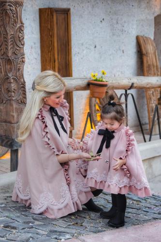 a woman and a little girl in pink dresses at Wish Cappadocia in Uchisar