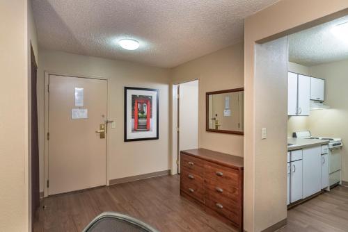 a kitchen with a sink and a dresser in a room at Extended Stay America Suites - Oklahoma City - Northwest in Oklahoma City