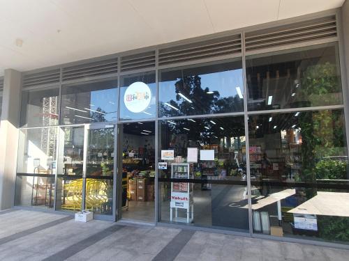 a store front of a store with large glass windows at Macquarie Park Paradise-City View in Sydney