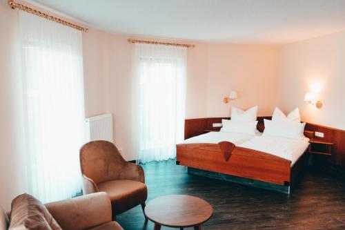 A bed or beds in a room at Hotel Lorösch