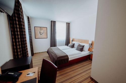 Ένα ή περισσότερα κρεβάτια σε δωμάτιο στο Hotel Ars Vivendi München