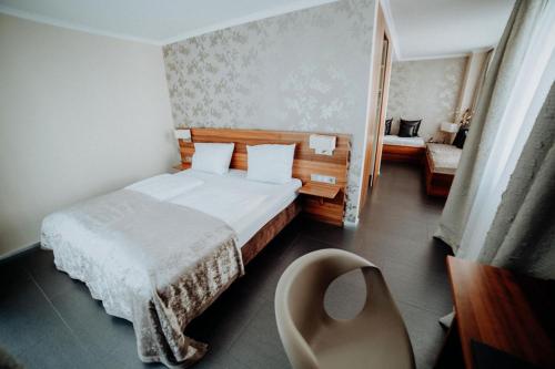 Tempat tidur dalam kamar di Hotel Ars Vivendi München
