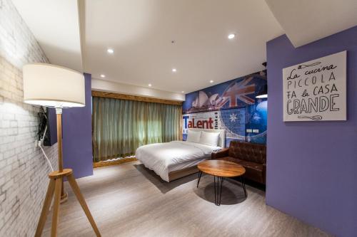 Postel nebo postele na pokoji v ubytování Talent Hotel