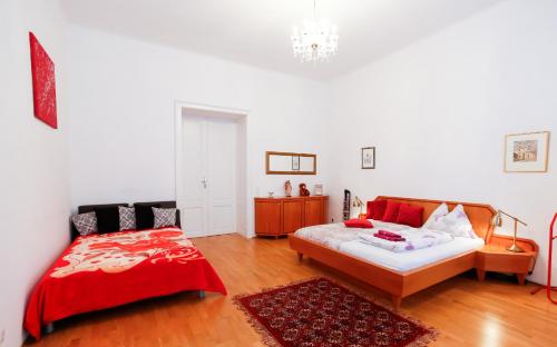 a bedroom with a bed and a dresser in it at Apartments Opera in Vienna