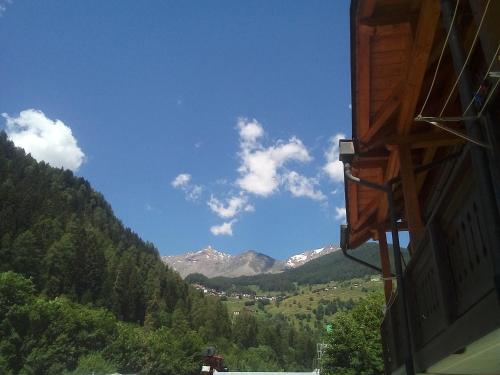 a view of a mountain range from a building at casa vacanze in Cogolo