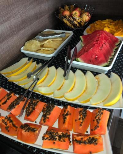 a tray of food with fruit on a table at Pousada SUN Victory in Cabo Frio