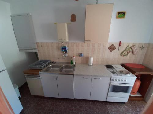 Kuchyň nebo kuchyňský kout v ubytování Apartman Matea