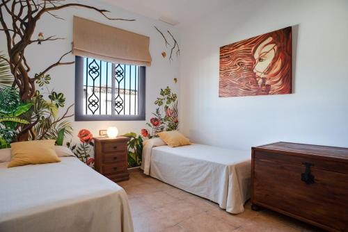 Ένα ή περισσότερα κρεβάτια σε δωμάτιο στο Chalet Acebuche