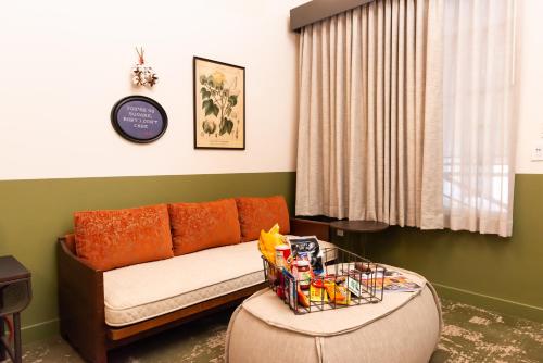 a living room with a couch and a table at Cotton Court Hotel, by Valencia Hotel Collection in Lubbock