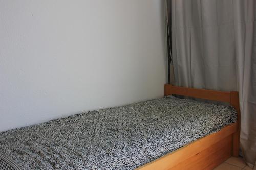 Tempat tidur dalam kamar di Pour une escapade marine à 500m de la plage des Becs