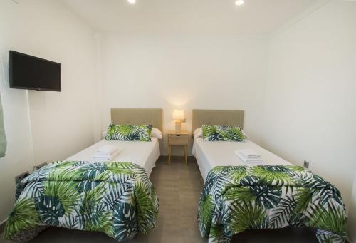 Posteľ alebo postele v izbe v ubytovaní Villas Guzman - Grandiosa