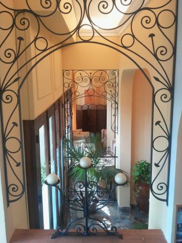 a hallway with a large mirror in a building at Jonic Hotel Mazzarò in Taormina
