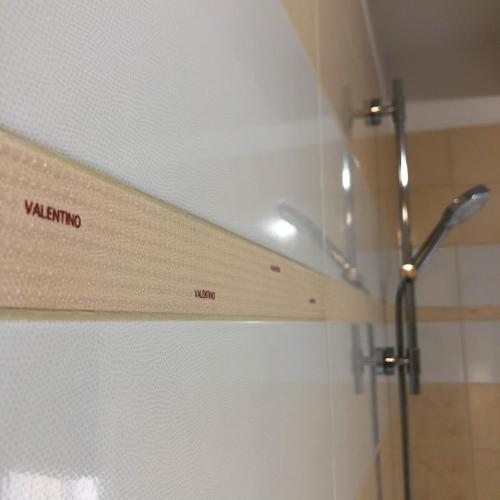 a shower stall with a wooden shelf in a bathroom at Villa Santoma Hill in Koper