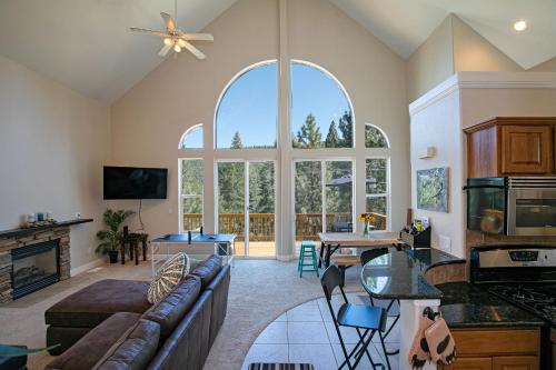 a living room with a couch and a table at Donner Lake Home Walk to the Lake Trails & Family Activities in Truckee