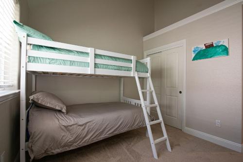 a bedroom with two bunk beds and a ladder at Donner Lake Home Walk to the Lake Trails & Family Activities in Truckee